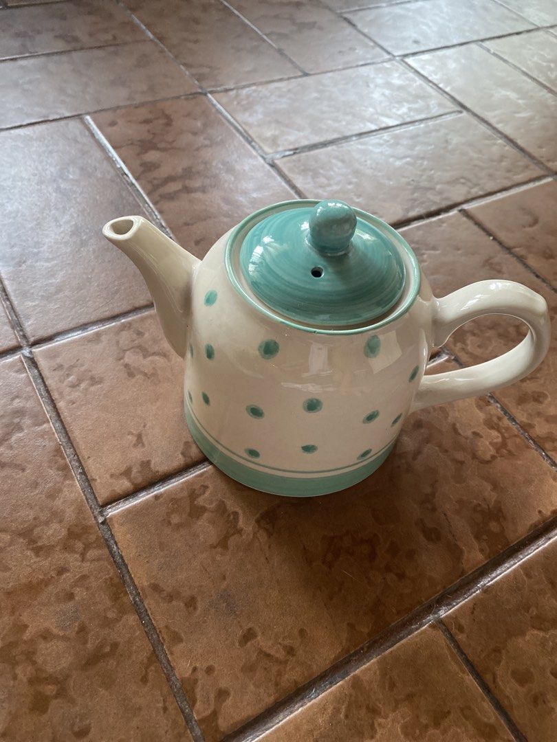 Ceramic Polka Dot Teapot (Category: Coffee & Tea Tableware) located in Cainta. Submitted by narraveranda (Listing ID 1448170021, Image 1). Description: - Adorable ceramic teapot - Light cream base with teal polka dots - Teal lid and trim - Comfortable handle for easy pouring - Solid and stable base - Ideal for serving tea or as a charming decorative piece - Perfect addition to your kitchen or a thoughtful gift.