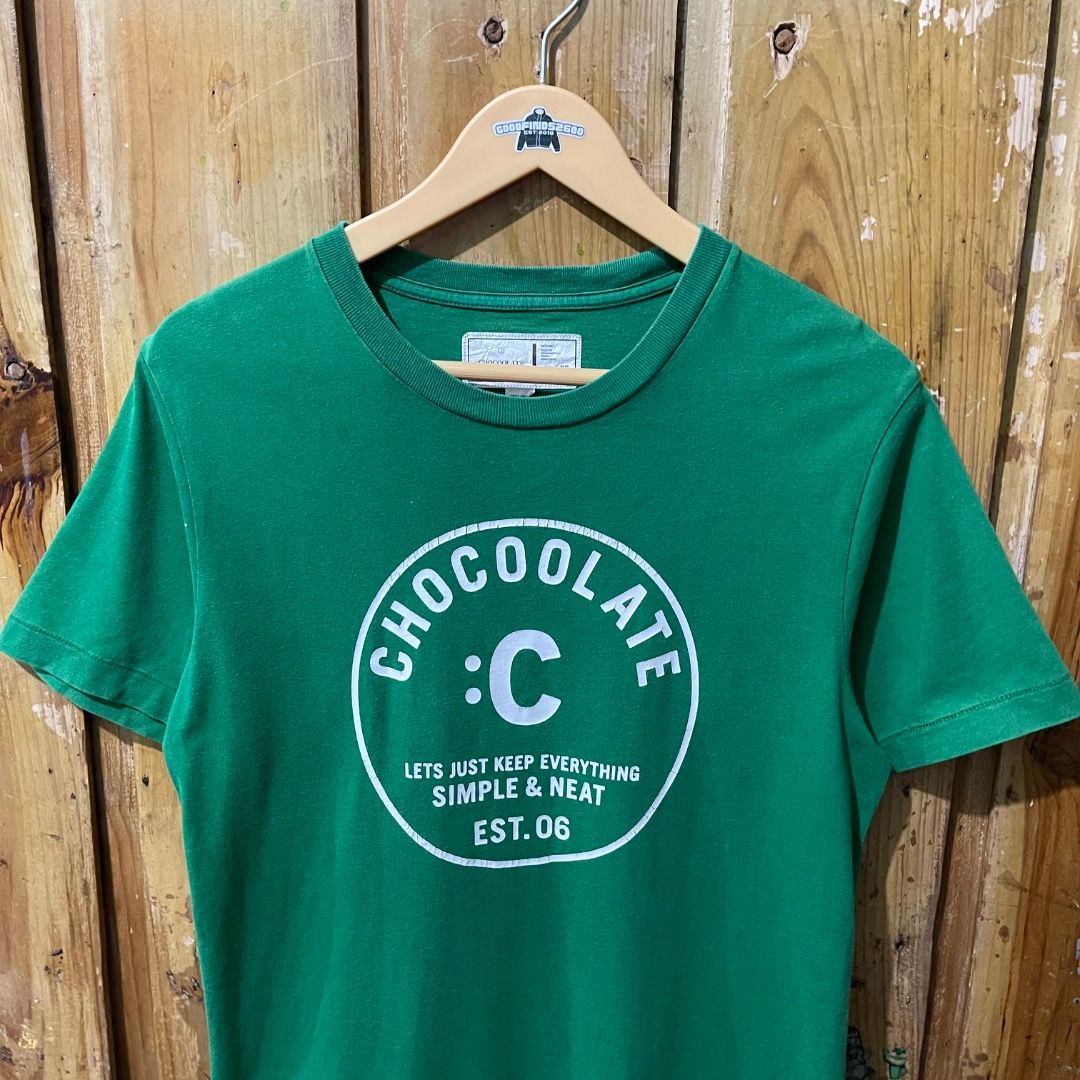 Chocoolate Green Logo Shirt (Category: Tshirts & Polo Shirts ) located in Baguio. Submitted by goodfinds2600v2 (Listing ID 1448196456, Image 2). Description: Size on tag: XS Dimensions: L- 25 W- 18.5 Description: Unisex Condition: Very Good Issue/s: faded on some areas (not noticeable) .