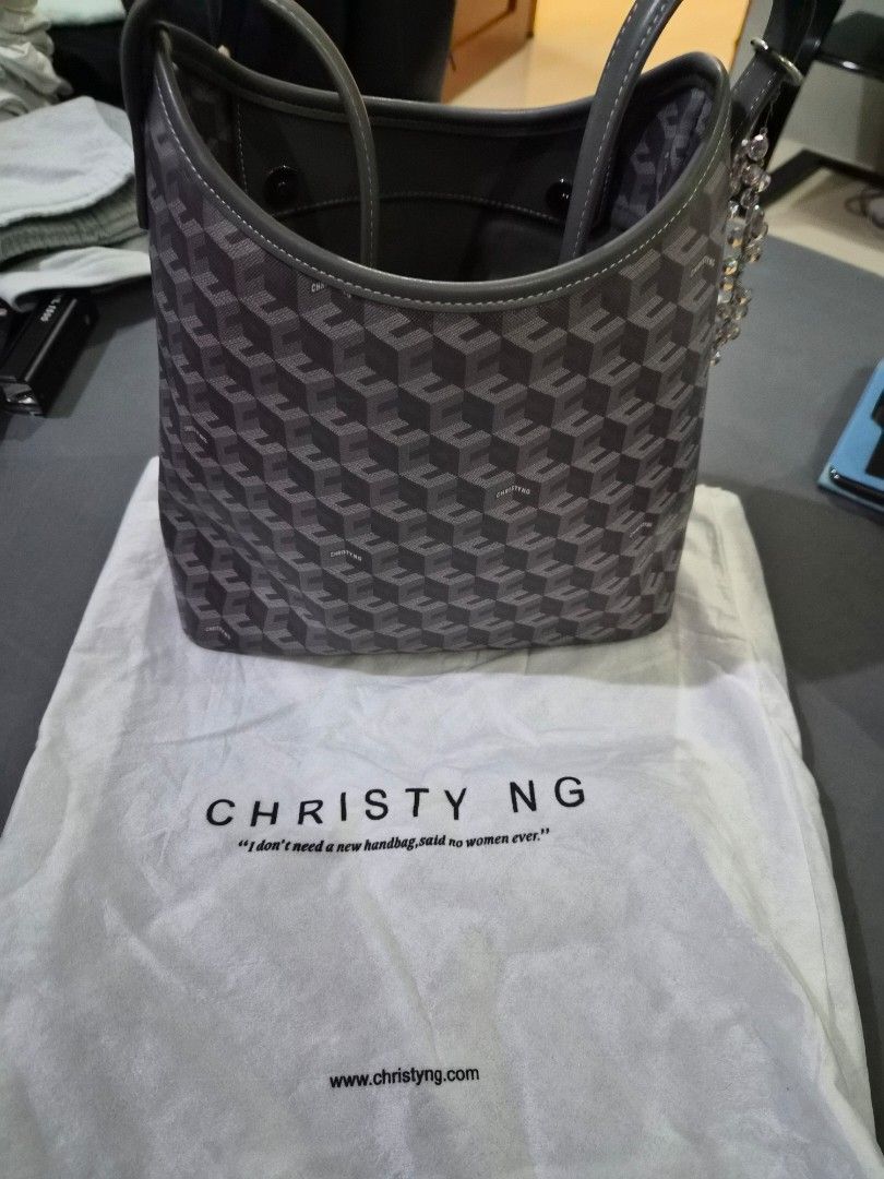 Christy Ng Monogram Shoulder Bag (Ash) (Category: Luxury Bags & Wallets) located in Las Pinas. Submitted by ktcuartina (Listing ID 1448197378, Image 2). Description: - Christy Ng shoulder bag - Signature monogram pattern in grey and black - Genuine leather trim and handles - Interior features a zipped pocket and a slip pocket - Comes with original dust bag - Ideal everyday bag.