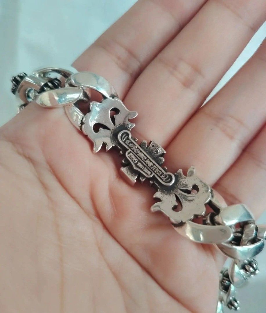 Chrome Hearts Bracelet Sterling Silver Fleur Cross (Category: Jewelry) located in Baguio. Submitted by thrifty_cool (Listing ID 1448274780, Image 3). Description: - Authentic Chrome Hearts bracelet - Material: 925 Sterling Silver - Design: Fleur cross - Clasp: Iconic toggle clasp - Engravings: 'CHROME HEARTS', '925', '2000' - Length: 22cm - A true statement piece for your collection.