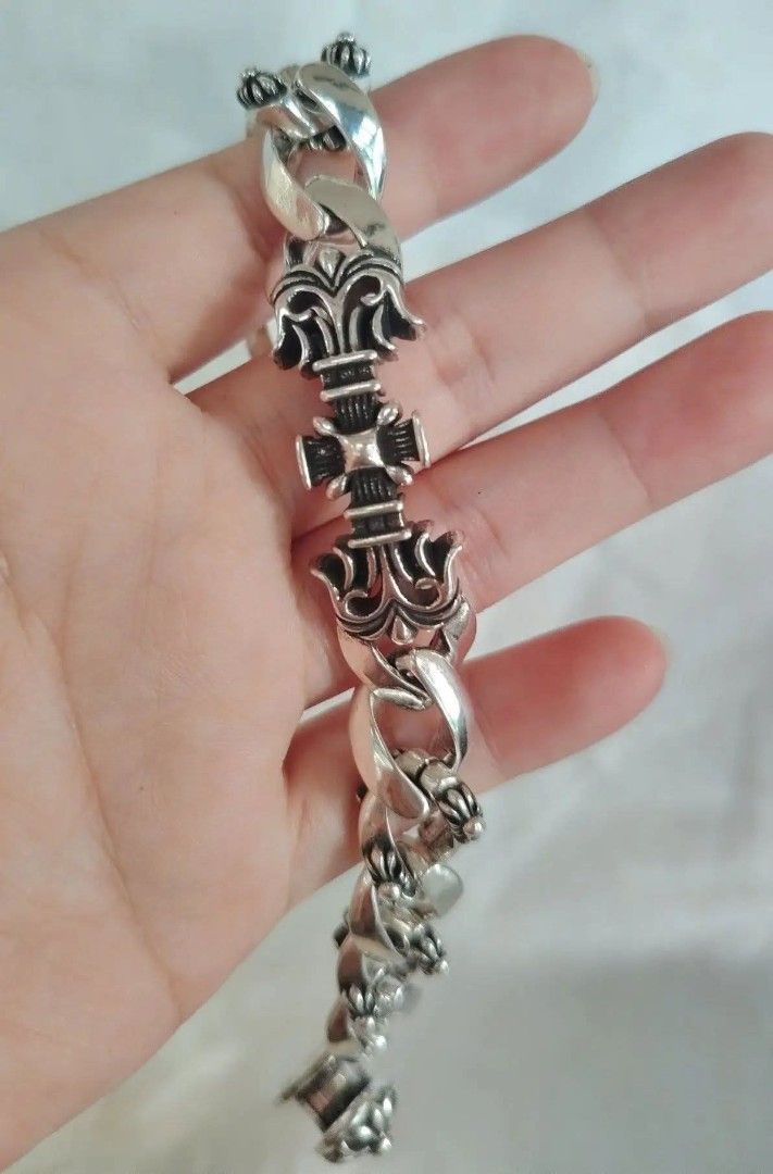 Chrome Hearts Bracelet Sterling Silver Fleur Cross (Category: Jewelry) located in Baguio. Submitted by thrifty_cool (Listing ID 1448274780, Image 2). Description: - Authentic Chrome Hearts bracelet - Material: 925 Sterling Silver - Design: Fleur cross - Clasp: Iconic toggle clasp - Engravings: 'CHROME HEARTS', '925', '2000' - Length: 22cm - A true statement piece for your collection.