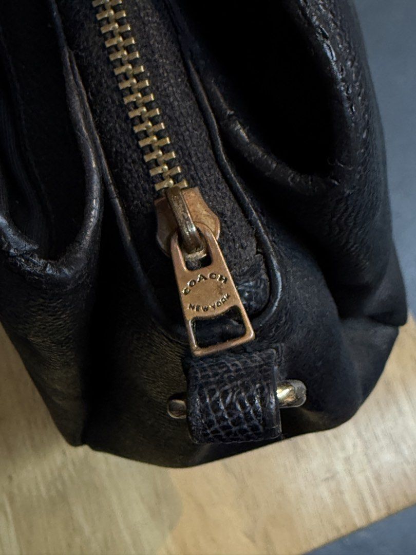 Coach Black Pebbled Leather Satchel Bag (Category: Luxury Bags & Wallets) located in Legazpi City. Submitted by deadthrift (Listing ID 1448260478, Image 3). Description: - Coach black pebbled leather satchel - Top handles and detachable crossbody strap - Secure zipper closure - Multiple interior compartments for organization - Elegant gold hardware details - Ideal everyday bag.