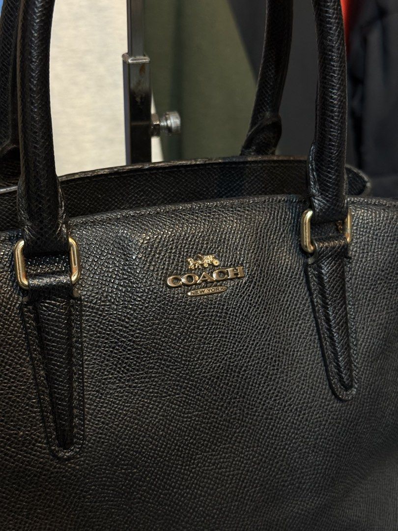 Coach Black Pebbled Leather Satchel Bag (Category: Luxury Bags & Wallets) located in Legazpi City. Submitted by deadthrift (Listing ID 1448260478, Image 2). Description: - Coach black pebbled leather satchel - Top handles and detachable crossbody strap - Secure zipper closure - Multiple interior compartments for organization - Elegant gold hardware details - Ideal everyday bag.