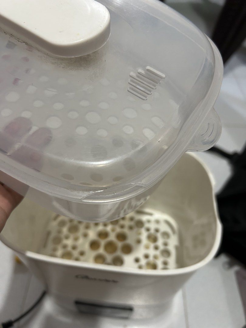 Cocobb Bottle Sterilizer Steamer Dryer (Category: Breastfeeding & Bottle Feeding) located in Navotas City. Submitted by ashiradani32783 (Listing ID 1448277538, Image 3). Description: - Cocobb bottle sterilizer - Steams and dries bottles - Multiple functions - Water stains inside the base - Dust on the lid - Still works well - Ideal for keeping baby bottles clean.