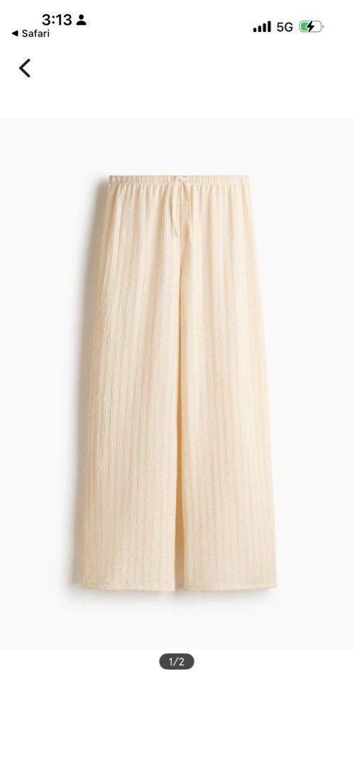 Cream Textured Wide Pants (Category: Other Bottoms) located in Mandaluyong City. Submitted by Marie (Listing ID 1448141681, Image 1). Description: - unnoticeable stain - Cream colored pants - Textured, crinkled fabric - Wide leg style - Drawstring waist for adjustable comfort - Super comfy and breathable - Ideal for lounging or casual outings.