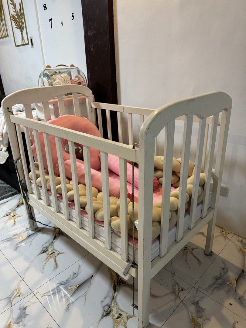 Crib (Category: Cots & Cribs) located in Manila. Submitted by sofia.things (Listing ID 1448263887, Image 3). Description: NO ISSUE PUNAS LANG AYAW NI BABY MAGPALAG LANG NEED KO LANG DIN SPACE SA HOUSE Set nayan with bumper foam 2 besides hotdog and breaast feeding pillow and meron din siyang diaper changing 24 inches lapad 40 inches haba 37inches taas -Crib size 24x40- Wooden crib palotsina set With diaper changing pad With 3 inch uratex foam Wit