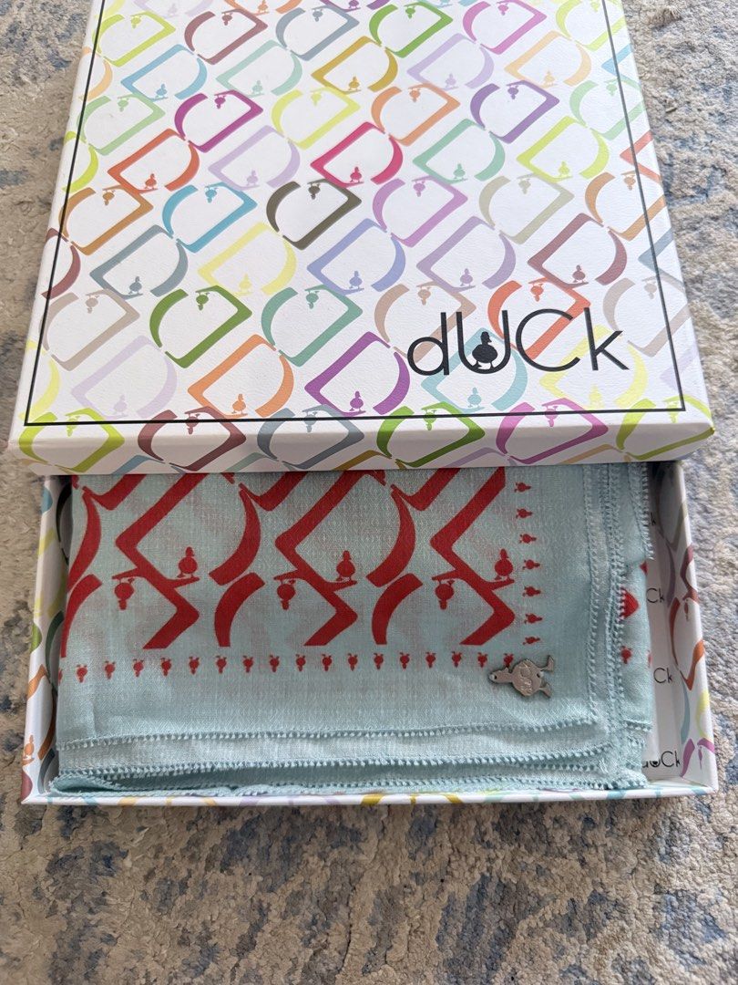 D Monogram Duck Voile Square Scarft in Razzelberry & Vanilla Blue (Category: Hijabs) located in Kuala Lumpur. Submitted by fatehnasoh61478 (Listing ID 1448097179, Image 2). Description: - Ori DUCK scarf - Original box included with DUCK logo - Unique red and blue pattern on a light blue base - Another DUCK scarf in purple is also available - Perfect for adding a pop of color to any outfit - Ideal accessory for fashion-forward individuals -In very
