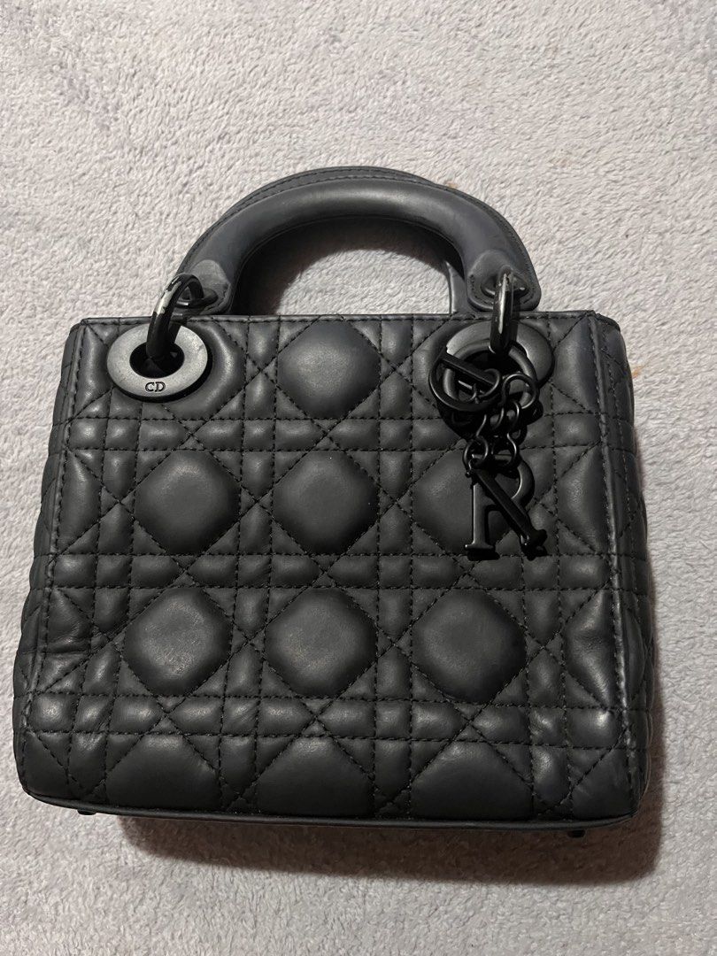 Dior Lady Dior Bag (Category: Luxury Bags & Wallets) located in Manila. Submitted by japanluxpallete (Listing ID 1448079274, Image 1). Description: - Classic Dior Lady Dior bag - Color: Black matte leather - Signature cannage stitching - Top handle and iconic charms - Size: Small - Condition: Minor scuffs on hardware and corners, overall beautiful condition.