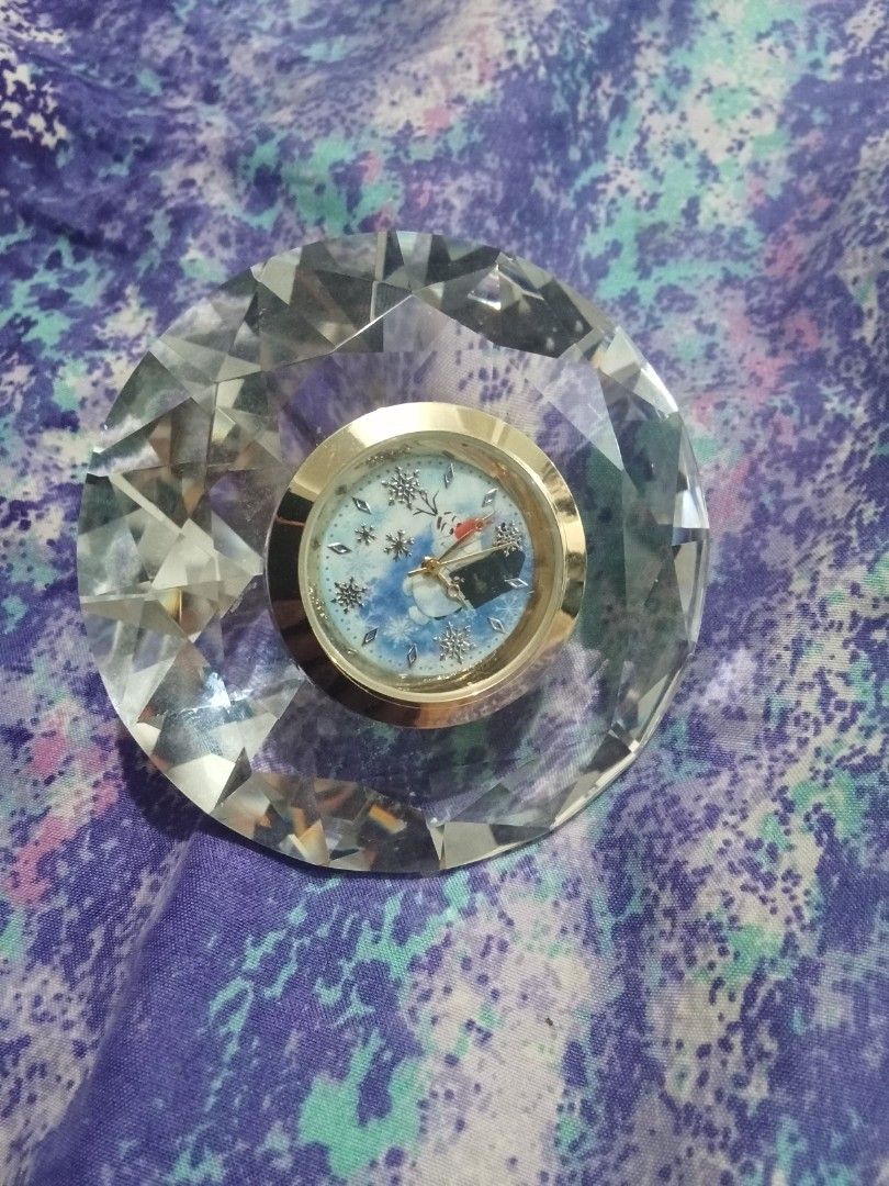 Disney Diamond Crystal Shape Clock (Category: Clocks) located in Bocaue. Submitted by marajapansurplus (Listing ID 1448231898, Image 1). Description: - Beautiful crystal clock with a unique diamond shape design. - Features a small clock face displaying an image of the Kaaba in Mecca. - Adds a touch of elegance to any desk or living space. - Makes a thoughtful and beautiful gift. - Selling as it is - Untested.