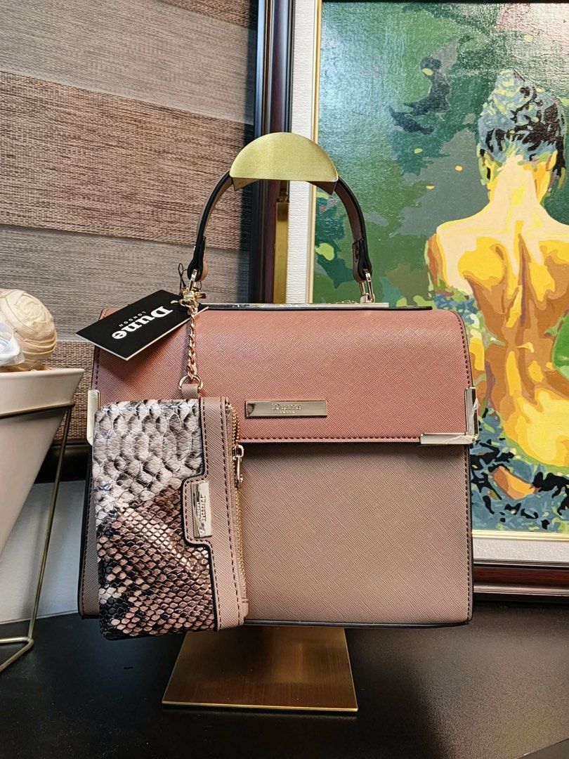 Dune London Two-Tone Structured Handbag with Pouch (Category: Luxury Bags & Wallets) located in Makati City. Submitted by bagattic_etc (Listing ID 1448094393, Image 1). Description: Chic two-tone Dune London handbag with flap closure and gold hardware. Includes a detachable snakeskin-effect pouch. Perfect for any occasion..