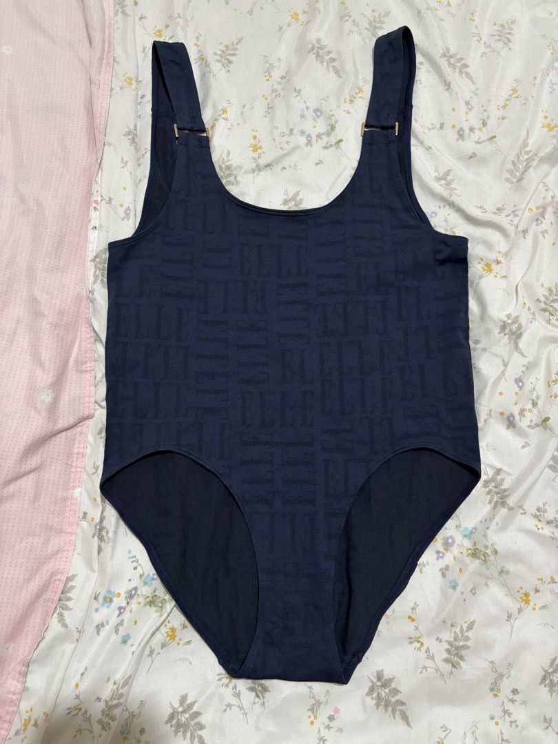 ELLE Navy Monogram Bodysuit/One-Piece Swimsuit (Category: Bikinis & Swimsuits) located in Marikina City. Submitted by koletteyy (Listing ID 1448242171, Image 1). Description: - Design: Subtle all-over monogram pattern - Features: Adjustable straps with gold-tone hardware, scoop neckline, low back - AUTHENTIC ELLE - never worn - no flaws - super stretchy small to semi large.