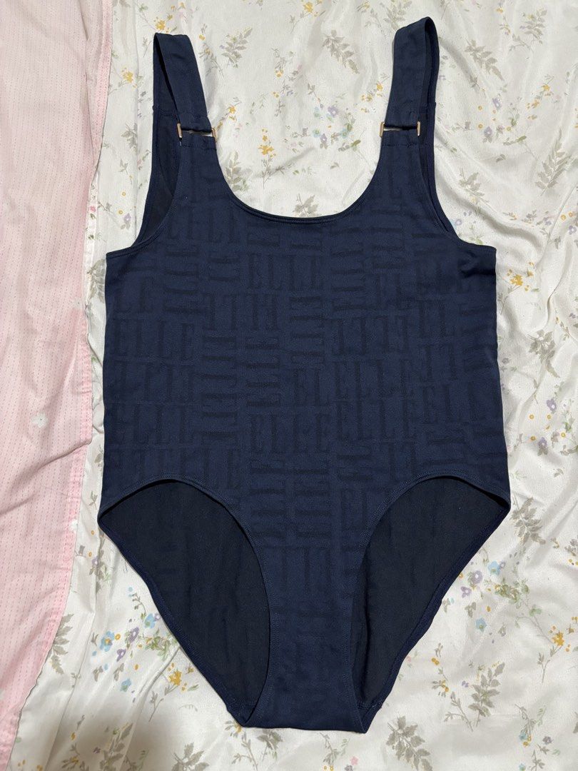 ELLE Navy Monogram Bodysuit/One-Piece Swimsuit (Category: Bikinis & Swimsuits) located in Marikina City. Submitted by koletteyy (Listing ID 1448242171, Image 2). Description: - Design: Subtle all-over monogram pattern - Features: Adjustable straps with gold-tone hardware, scoop neckline, low back - AUTHENTIC ELLE - never worn - no flaws - super stretchy small to semi large.