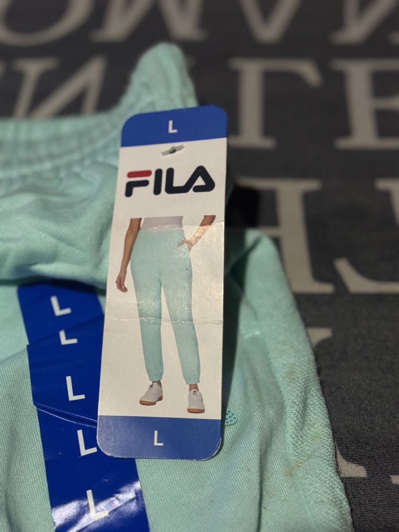 Fila Light Mint Green Sweatpants Joggers Size L (Category: Other Bottoms) located in Manila. Submitted by _ravenqueen (Listing ID 1448227852, Image 2). Description: - Brand new Fila sweatpants - Light mint green color - Jogger style - Elastic waistband and cuffs - Size L - Made in Vietnam - Perfect for lounging or casual wear - Tags attached.