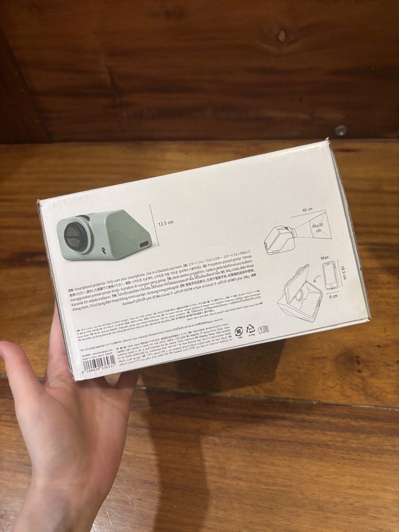 Flying Tiger Smartphone Projector - Green (Category: Projectors) located in Manila. Submitted by pepper7779 (Listing ID 1448267961, Image 3). Description: - Project your smartphone screen up to 40cm x 40cm. - Made from recycled materials for an eco-conscious choice. - Simple setup: just slide your phone in. - Best results in a dark room..