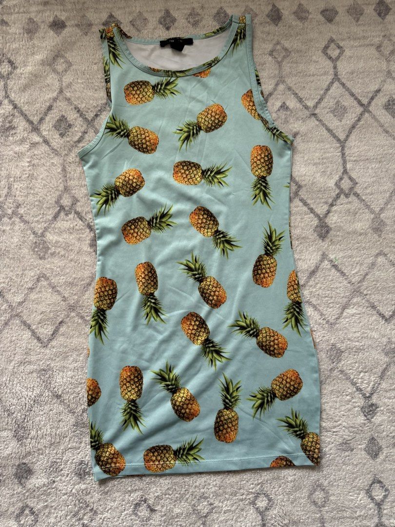 Forever 21 Pineapple Print Tank Dress (Category: Dresses) located in Manila. Submitted by chaz16 (Listing ID 1448168482, Image 1). Description: - Light blue tank dress - Fun all-over pineapple print - Sleeveless design - Stretchy material for comfort - Hits above the knee - Ideal for casual wear or a tropical vibe.