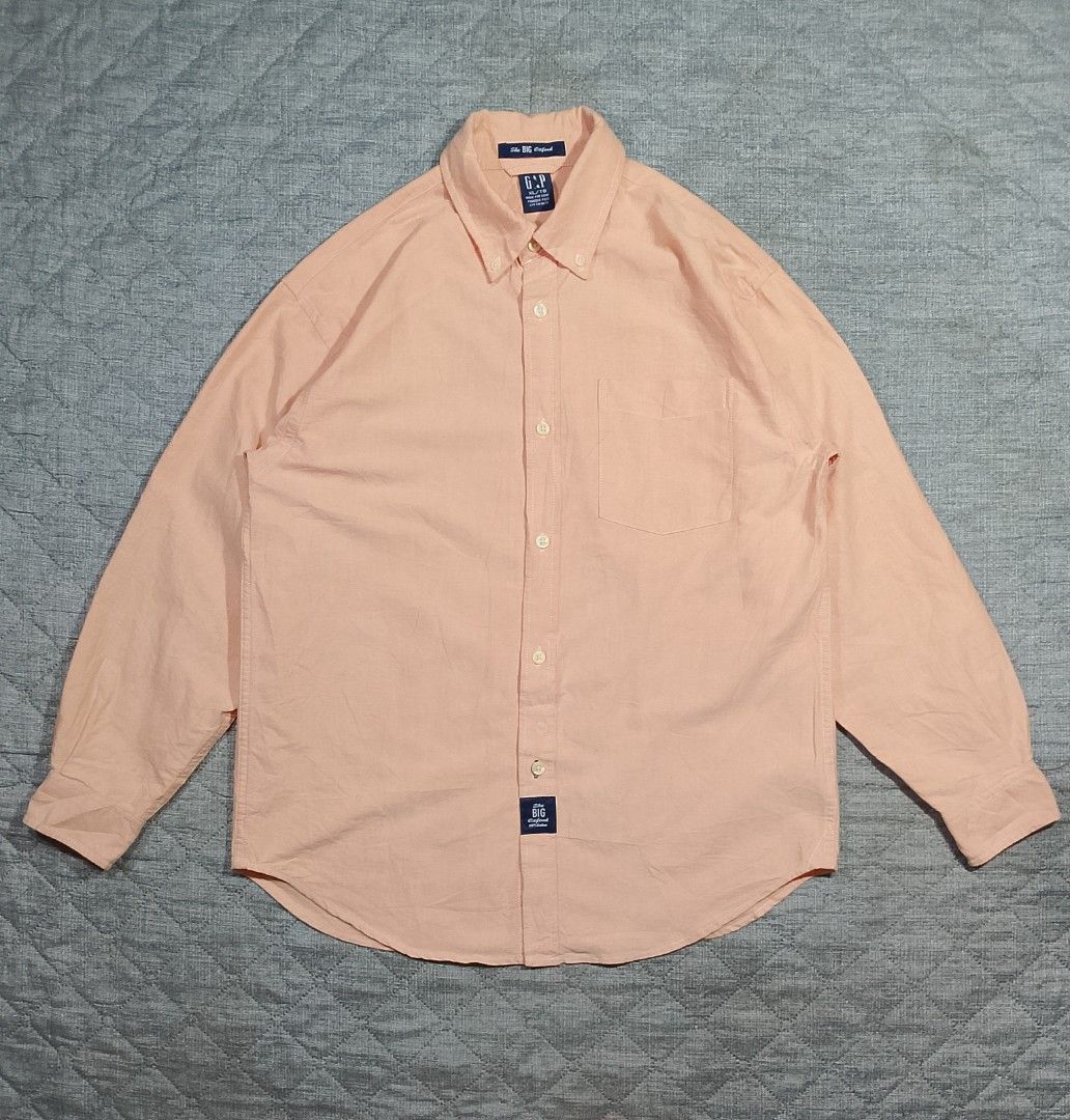 Gap peach Oxford button down long sleeves shirt (Category: Formal Shirts) located in Cadiz. Submitted by comradstuff (Listing ID 1448090076, Image 1). Description: Gap peach Oxford button down long sleeves shirt w 20.5" l 27".