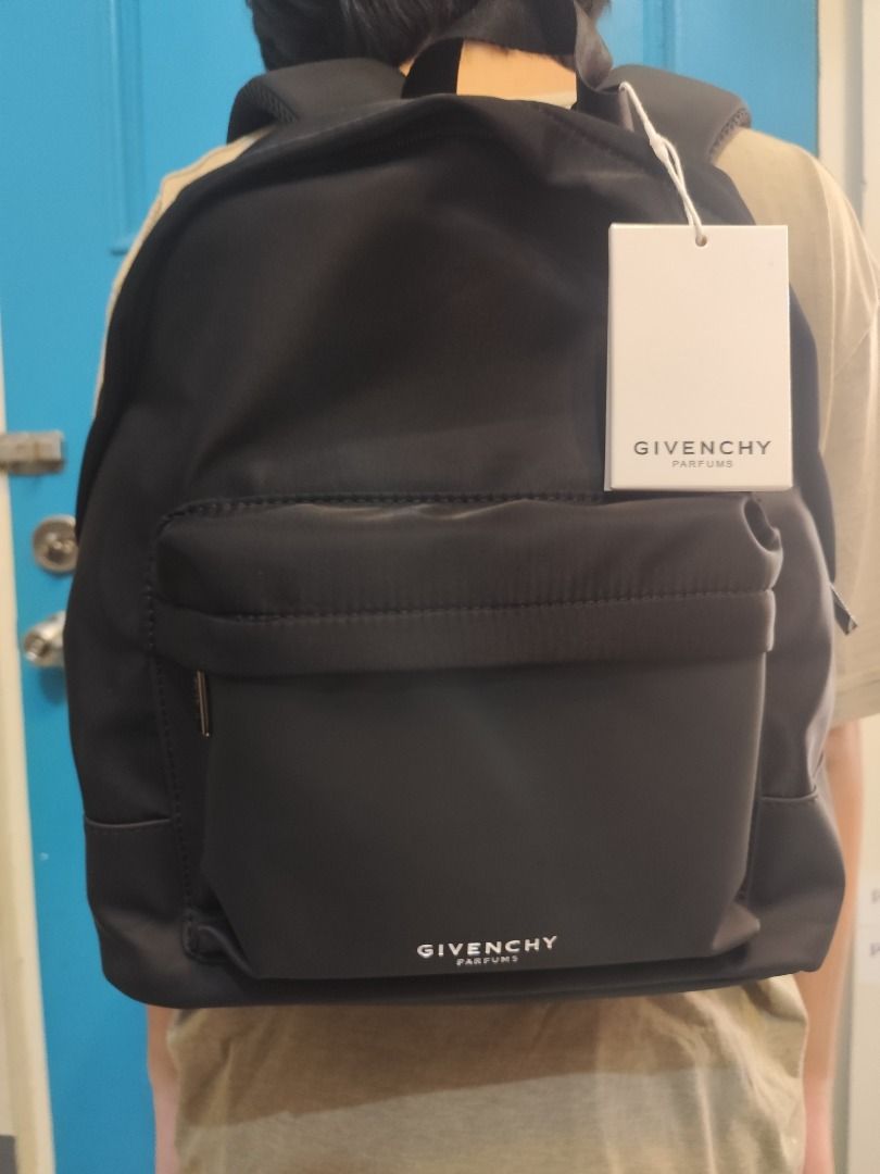 Givenchy Parfums Black Nylon Backpack (Category: Backpacks) located in Caloocan City. Submitted by refreshmycloset444 (Listing ID 1448177305, Image 2). Description: - Black Givenchy Parfums backpack GWP - Made from durable nylon - Front pocket with secure zipper closure - Iconic Givenchy logo printed on the front - Logo detail on the zipper pull - Padded shoulder straps for maximum comfort - Brand new with original tag still attached.