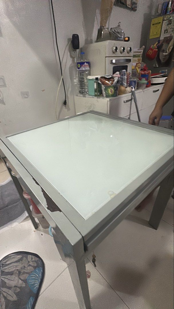 Glass Top Dining Table (extendable) slightly negotiable (Category: Tables & Sets) located in Pasig City. Submitted by wisemomph (Listing ID 1448153391, Image 2). Description: For Sale: Modern Extendable Glass Top Dining Table Selling this sleek, modern glass top dining table originally purchased from Furniture Source. It has a clean look, a sturdy build, and a highly functional, space-saving design. 💰 Price: ₱6,000 (Slightly negotiable) Original