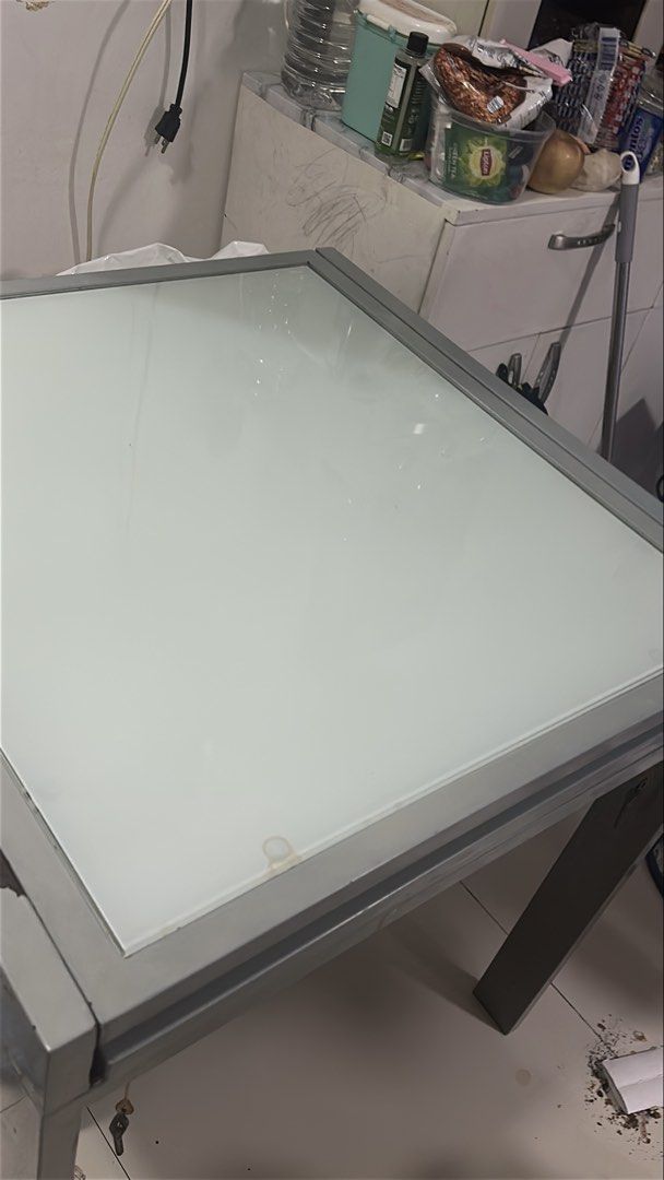 Glass Top Dining Table (extendable) slightly negotiable (Category: Tables & Sets) located in Pasig City. Submitted by wisemomph (Listing ID 1448153391, Image 1). Description: For Sale: Modern Extendable Glass Top Dining Table Selling this sleek, modern glass top dining table originally purchased from Furniture Source. It has a clean look, a sturdy build, and a highly functional, space-saving design. 💰 Price: ₱6,000 (Slightly negotiable) Original
