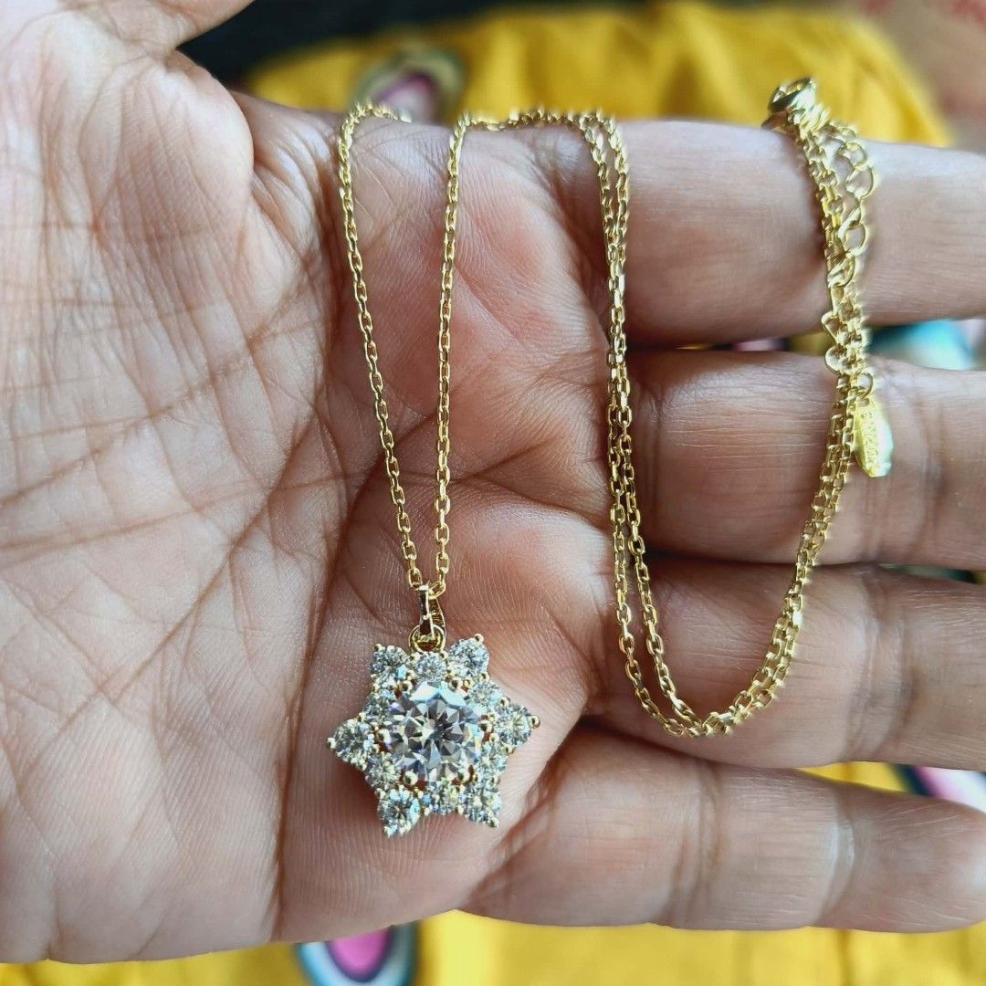 Gold Chain Necklace with Snowflake Pendant (Category: Necklaces) located in Cagayan de Oro. Submitted by mmmdshop (Listing ID 1448176198, Image 2). Description: - Delicate gold chain necklace, approximately 18 inches long. - Features a sparkly snowflake pendant encrusted with clear stones. - Secure lobster clasp closure. - Adds a beautiful sparkle to any outfit. - Ideal for gifting or personal treat..