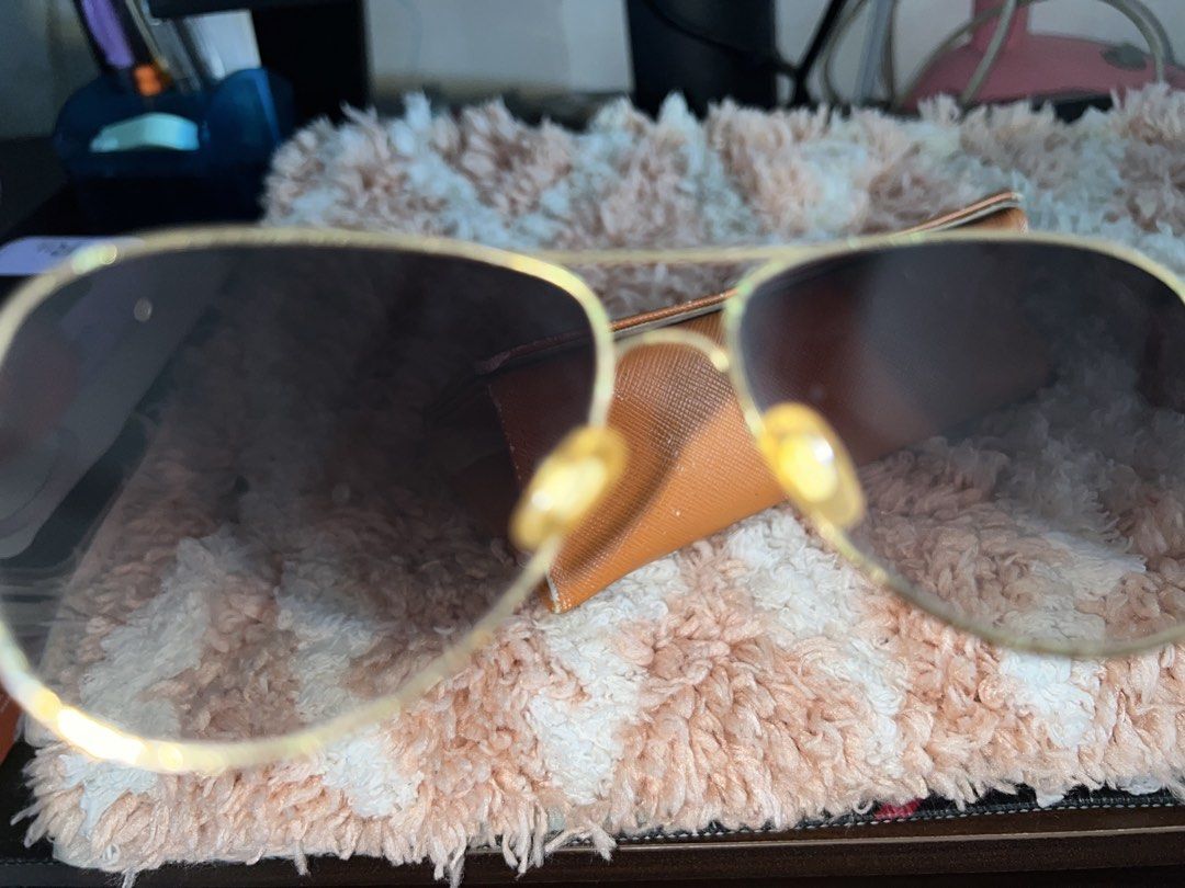 Gold Frame Sunglasses with Brown Lenses (Category: Sunglasses & Eyewear) located in Nasugbu. Submitted by rruth05 (Listing ID 1448120773, Image 2). Description: - Classic gold frame sunglasses - Brown gradient lenses for sun protection - Comes with an orange case - Perfect for everyday wear.