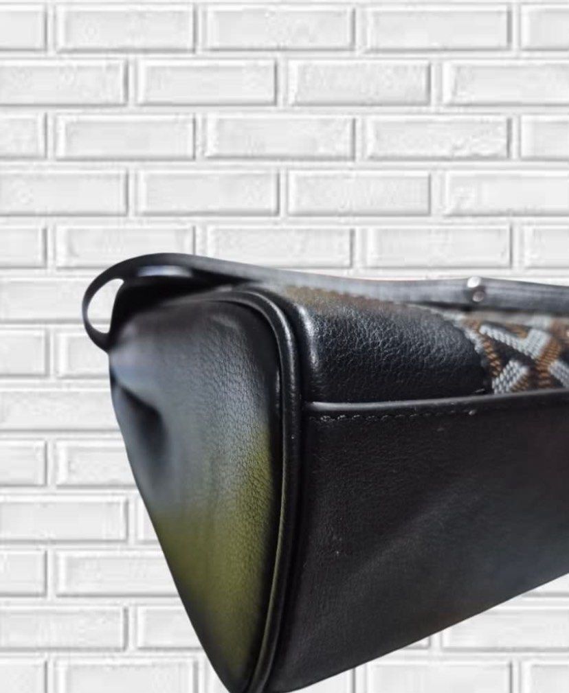Goyard Mini Saigon Top Handle Bag (Category: Luxury Bags & Wallets) located in General Santos City (Dadiangas). Submitted by mj_luxuries_bags_and_stuff (Listing ID 1448140149, Image 2). Description: - Classic Goyardine pattern in black leather and canvas - Unique wooden top handle - Detachable shoulder strap for versatility - Secure buckle closure on the front flap - Spacious interior for all your essentials - Ideal for everyday use, work, or cas
