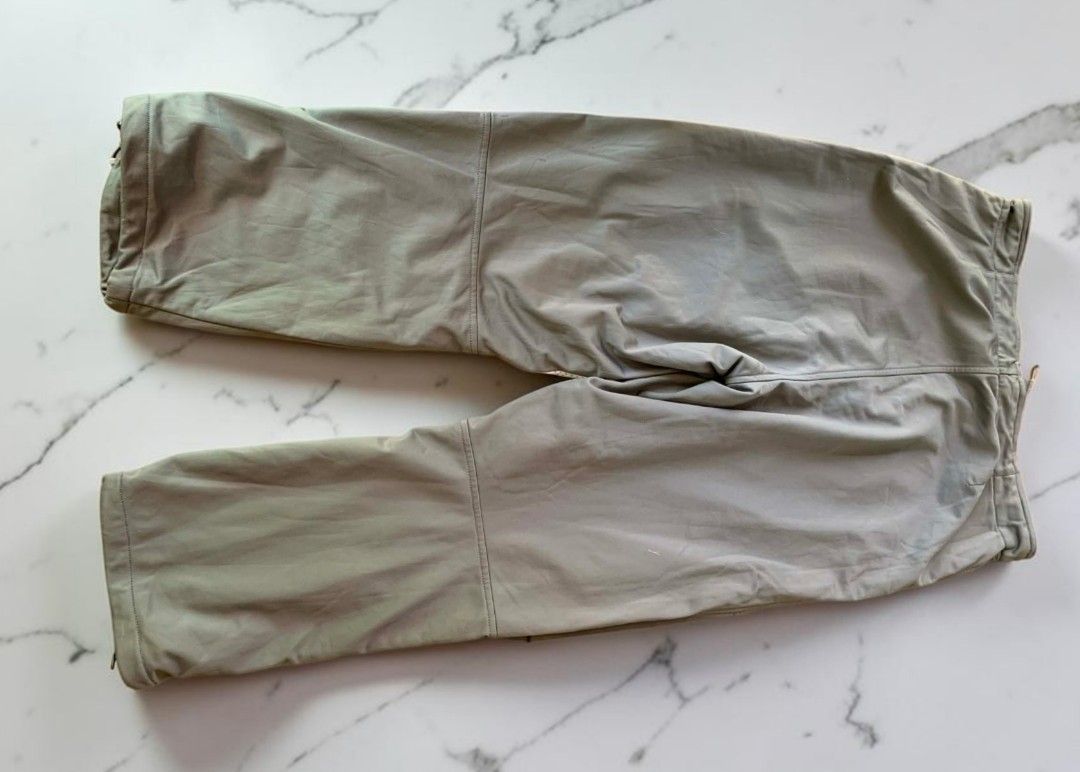 Grey Cargo Pants with Japanese Symbol (Category: Jeans) located in Mangaldan. Submitted by michelle_2004 (Listing ID 1448135020, Image 2). Description: - Grey cargo pants - Drawstring waist - Adjustable ankle cuffs - Unique Japanese symbol graphic on left thigh - Made of 100% polyester - Ideal for casual wear or outdoor activities.