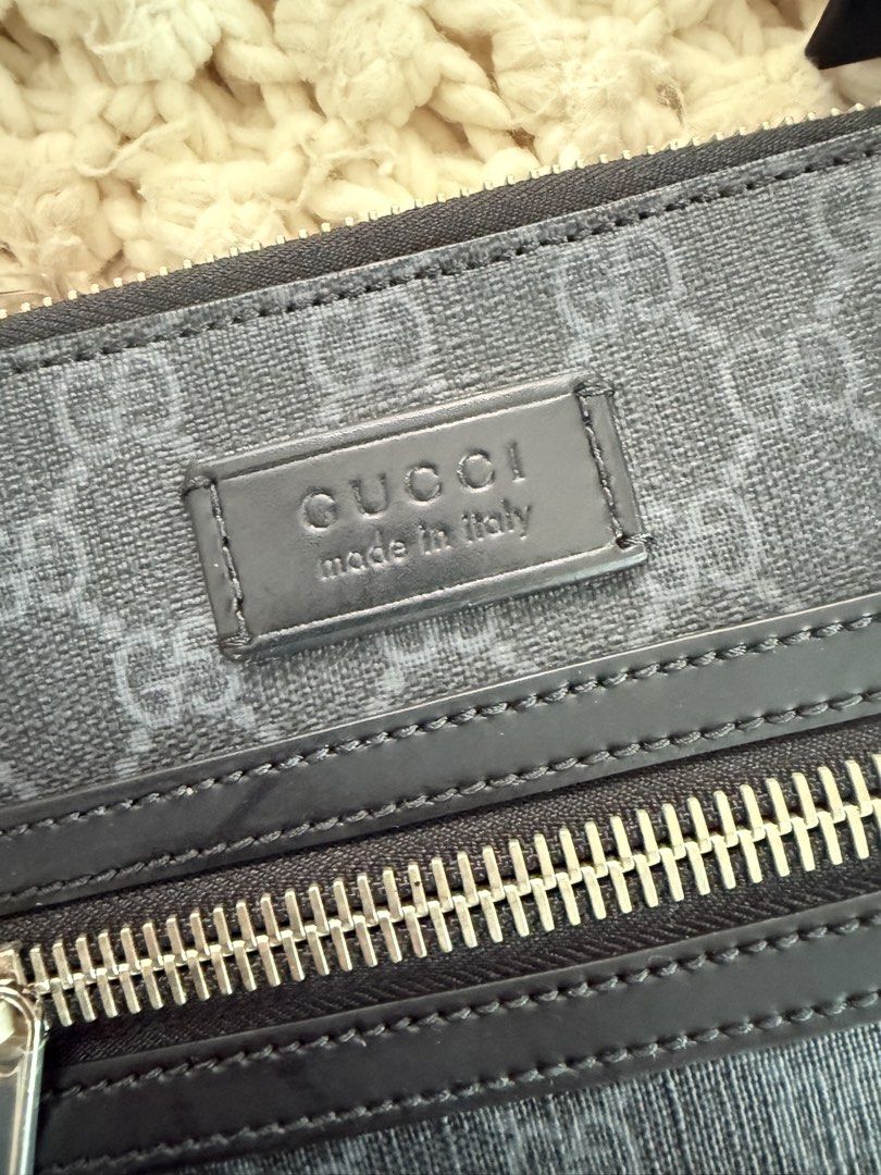 Gucci GG Supreme Monogram Crossbody Bag (Category: Luxury Bags & Wallets) located in Cebu City. Submitted by sararanile (Listing ID 1448086111, Image 3). Description: Authentic Gucci GG Supreme crossbody bag in black and grey. Features a front zip pocket and adjustable red/blue stripe strap. Made in Italy. Includes dust bag. 100% authentic .