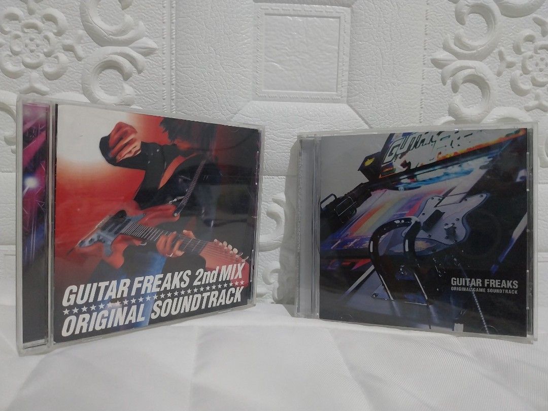 Guitar Freaks 2nd Mix Original Soundtrack CD BUNDLE (Category: CDs & DVDs) located in Tagum. Submitted by boykolekgadgetstuff (Listing ID 1448208373, Image 1). Description: - Two Guitar Freaks CDs for sale. - Includes Guitar Freaks 2nd Mix Original Soundtrac - Perfect for fans of the Guitar Freaks game series. - Ideal for rhythm music enthusiasts. - Both CDs are in their original cases..