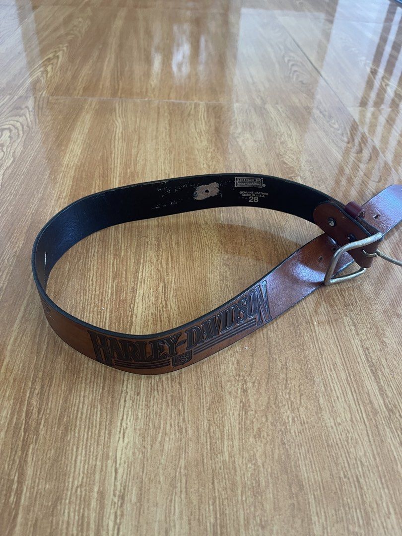 Harley-Davidson USA Leather Belt (Category: Belts) located in Tarlac. Submitted by supremo.0 (Listing ID 1448081100, Image 2). Description: - Genuine brown leather belt - Features iconic Harley-Davidson USA branding - Embossed eagle graphic on the leather - Sturdy metal buckle - Estimated size: 28 - Minor wear on the inside lining - Ideal for any Harley-Davidson fan or collector.