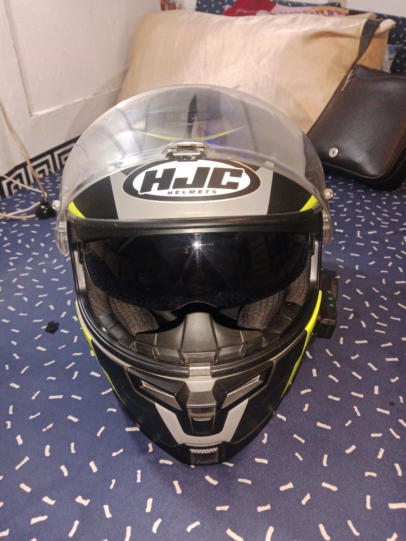 HJC Motorcycle Helmet with Bluetooth Communicator (Category: Other Sports Equipment and Supplies) located in Manila. Submitted by greyscale1995 (Listing ID 1448205176, Image 3). Description: - HJC Full-Face Motorcycle Helmet - Size: XL - Color Scheme: Black, Grey, and Neon Yellow - Features: Flip-up visor, integrated sun visor - Includes: Freedconn Bluetooth communicator - Condition: Ready for your next ride!.