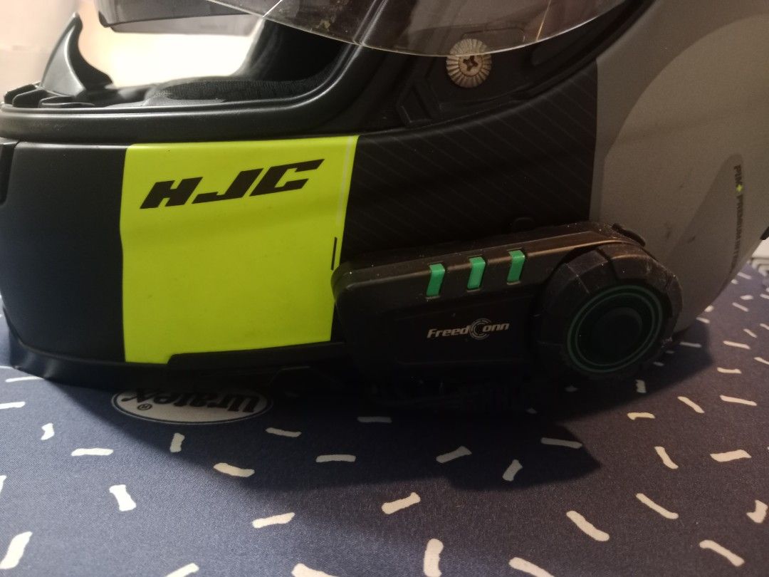 HJC Motorcycle Helmet with Bluetooth Communicator (Category: Other Sports Equipment and Supplies) located in Manila. Submitted by greyscale1995 (Listing ID 1448205176, Image 2). Description: - HJC Full-Face Motorcycle Helmet - Size: XL - Color Scheme: Black, Grey, and Neon Yellow - Features: Flip-up visor, integrated sun visor - Includes: Freedconn Bluetooth communicator - Condition: Ready for your next ride!.