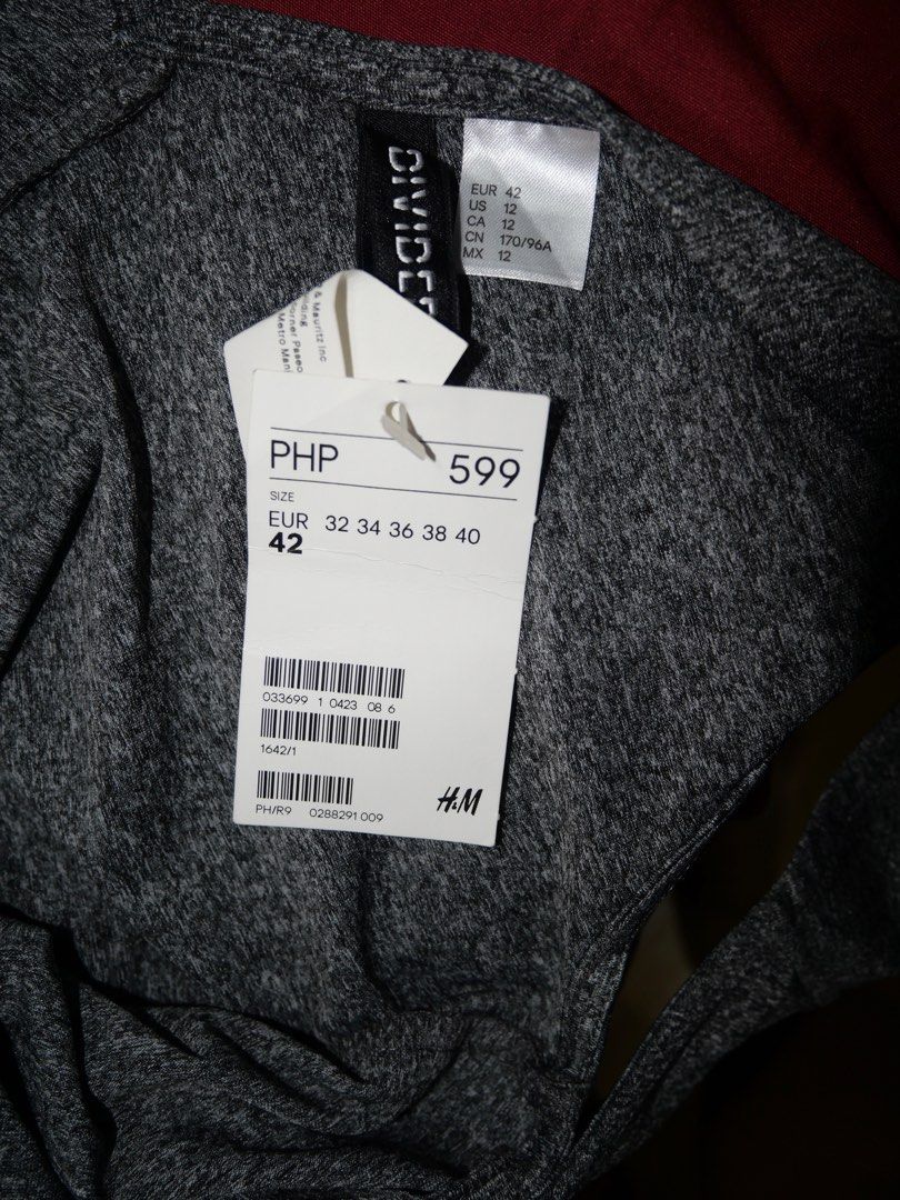 H&M Divided Grey Sleeveless Dress (Category: Dresses) located in Manila. Submitted by briesbees (Listing ID 1448189838, Image 3). Description: - Grey H&M Divided dress - Sleeveless design - Fit and flare silhouette - Subtle marled fabric texture - Original tags still attached - Versatile for casual or dressed-up occasions.