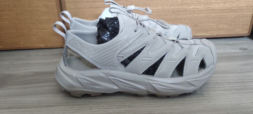 Hoka One One Hopara Sandals (Category: Sandals) located in San Mateo. Submitted by roxyj120919 (Listing ID 1448193161, Image 3). Description: - Hoka One One Hopara Sandals - Color: Light Grey - Size: US 7.5 W 6.5 M - Ideal for hiking and everyday wear - Unique design with cutouts - Thick sole for excellent cushioning - Easy to put on and take off.