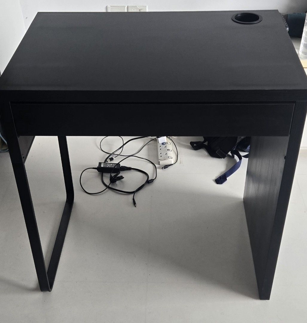 IKEA- Computer/Study Compact Table (Category: Tables & Sets) located in Singapore. Submitted by jishnu_narayanan (Listing ID 1448142375, Image 2). Description: - Like new Computer Table/Study Desk from Ikea. - Ikea Micke Desk(Dimension : 73×50cm) - Condition : Like new, No markings even in the white area. - Original Price from IKEA : 90 SGD. - Sleek black study desk - Built-in drawer for convenient storage - Tabletop cable management hole - Sturd