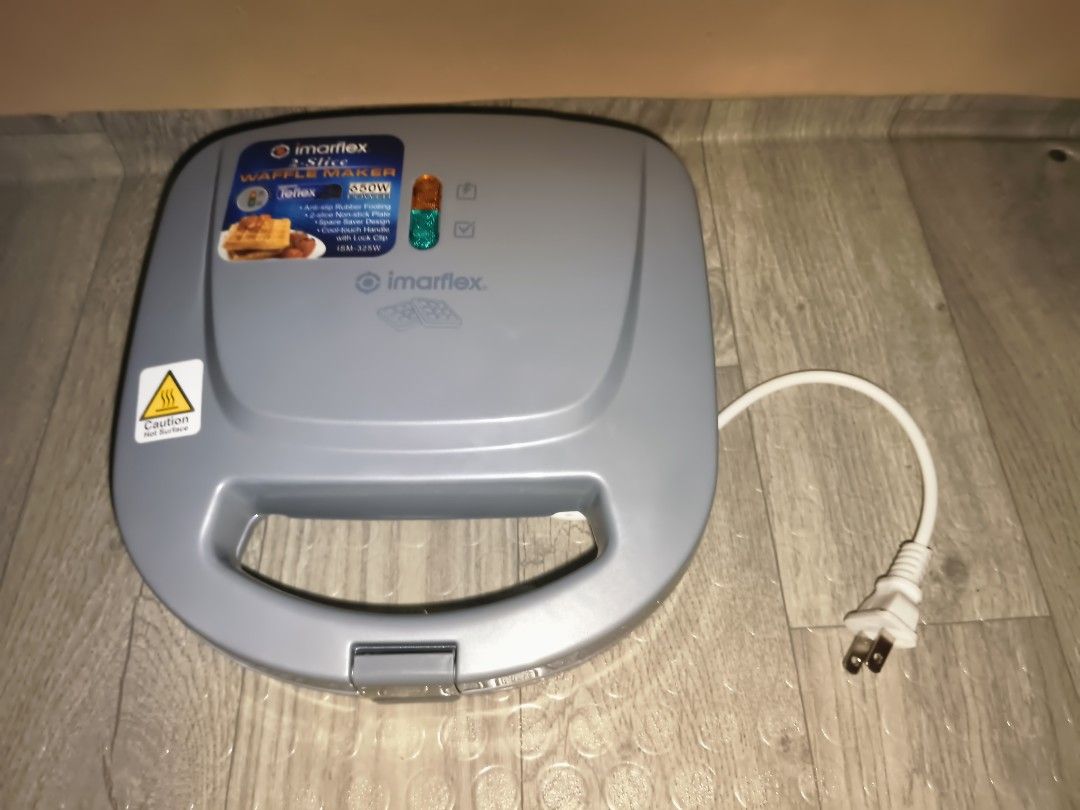 Imarflex 2-Slice Waffle Maker ISM-325W (Category: Other Kitchen Appliances) located in Pasig City. Submitted by xmryplyn (Listing ID 1448262069, Image 3). Description: Imarflex 2-slice waffle maker. 650W power. Teflex non-stick plates. Space saver design. Anti-slip rubber footing. Cool-touch handle with link clip. Ready light indicator. Works well..