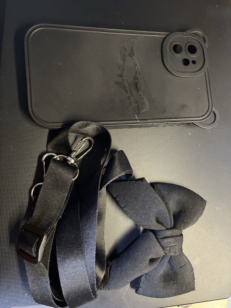 iPhone 11 Case Black with Ribbon and Strap (Category: Cases & Sleeves) located in Manila. Submitted by rosetteliab (Listing ID 1448248301, Image 3). Description: Ribbon was detached from the case, can be attached using mighty bond. Strap is still functional..