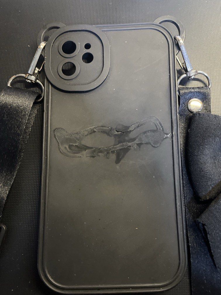 iPhone 11 Case Black with Ribbon and Strap (Category: Cases & Sleeves) located in Manila. Submitted by rosetteliab (Listing ID 1448248301, Image 2). Description: Ribbon was detached from the case, can be attached using mighty bond. Strap is still functional..