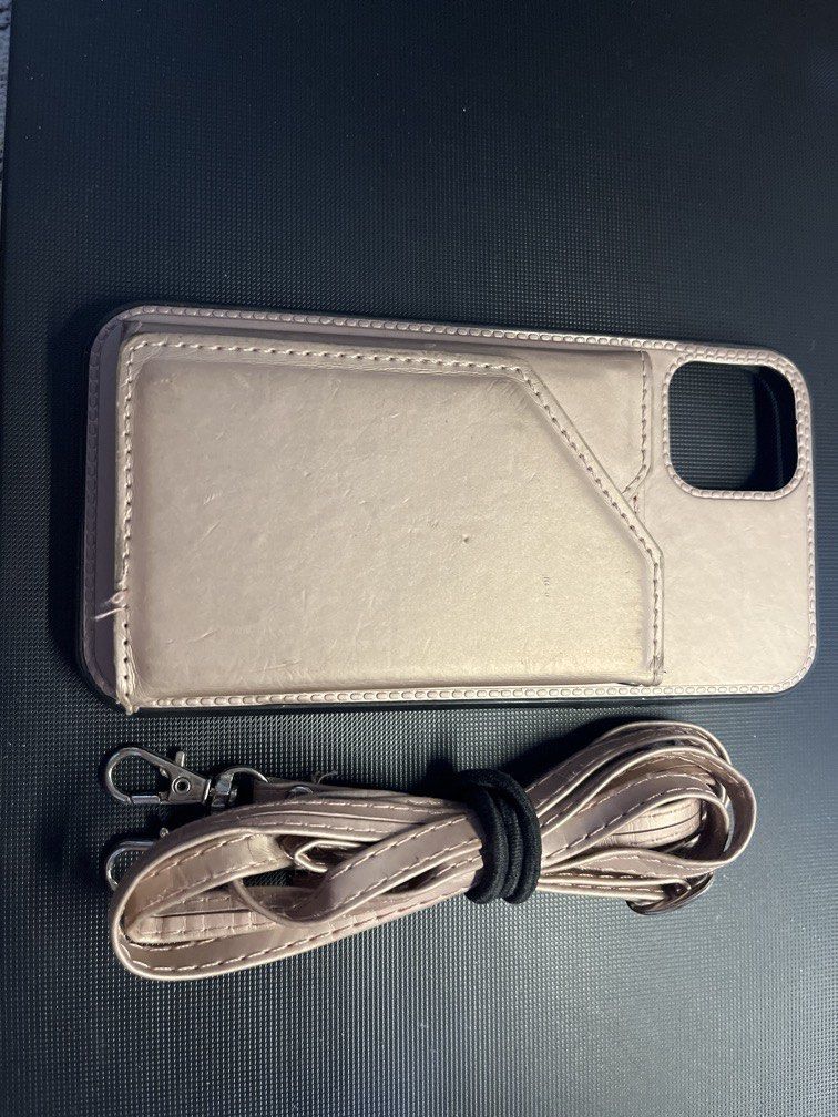 iPhone 11 Case with Wallet and Strap (Category: Cases & Sleeves) located in Manila. Submitted by rosetteliab (Listing ID 1448247610, Image 1). Description: Has signs of usage as seen in the pictures. Wallet can still hold cards. Strap is still in good condition but can only be hooked on one side. .