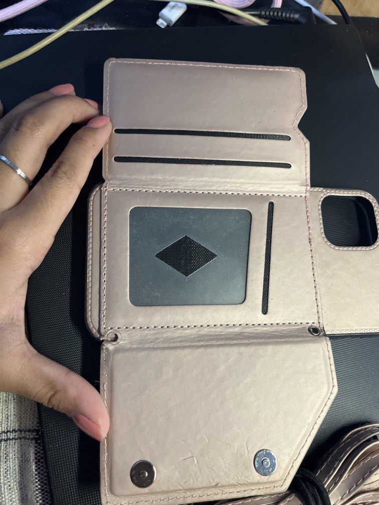 iPhone 11 Case with Wallet and Strap (Category: Cases & Sleeves) located in Manila. Submitted by rosetteliab (Listing ID 1448247610, Image 3). Description: Has signs of usage as seen in the pictures. Wallet can still hold cards. Strap is still in good condition but can only be hooked on one side. .