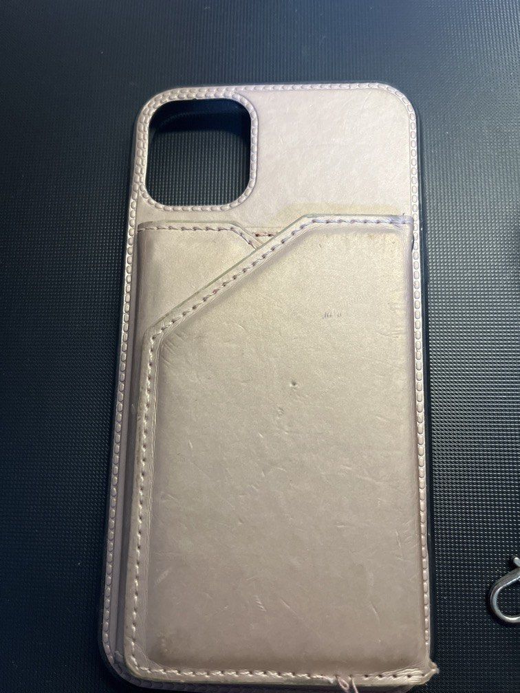 iPhone 11 Case with Wallet and Strap (Category: Cases & Sleeves) located in Manila. Submitted by rosetteliab (Listing ID 1448247610, Image 2). Description: Has signs of usage as seen in the pictures. Wallet can still hold cards. Strap is still in good condition but can only be hooked on one side. .