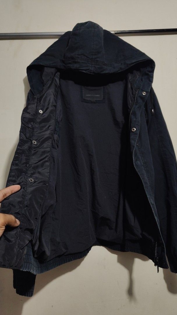 Jack & Jones Dark Blue Hooded Utility Jacket (Category: Coats, Jackets and Outerwear) located in Bulacan. Submitted by adrian2325 (Listing ID 1448099061, Image 3). Description: - Dark blue Jack & Jones jacket - Features a hood - Multiple front pockets - Zip and button closure - Ribbed hem and cuffs - Perfect for casual wear - Estimated size L or XL (check measurements if needed).