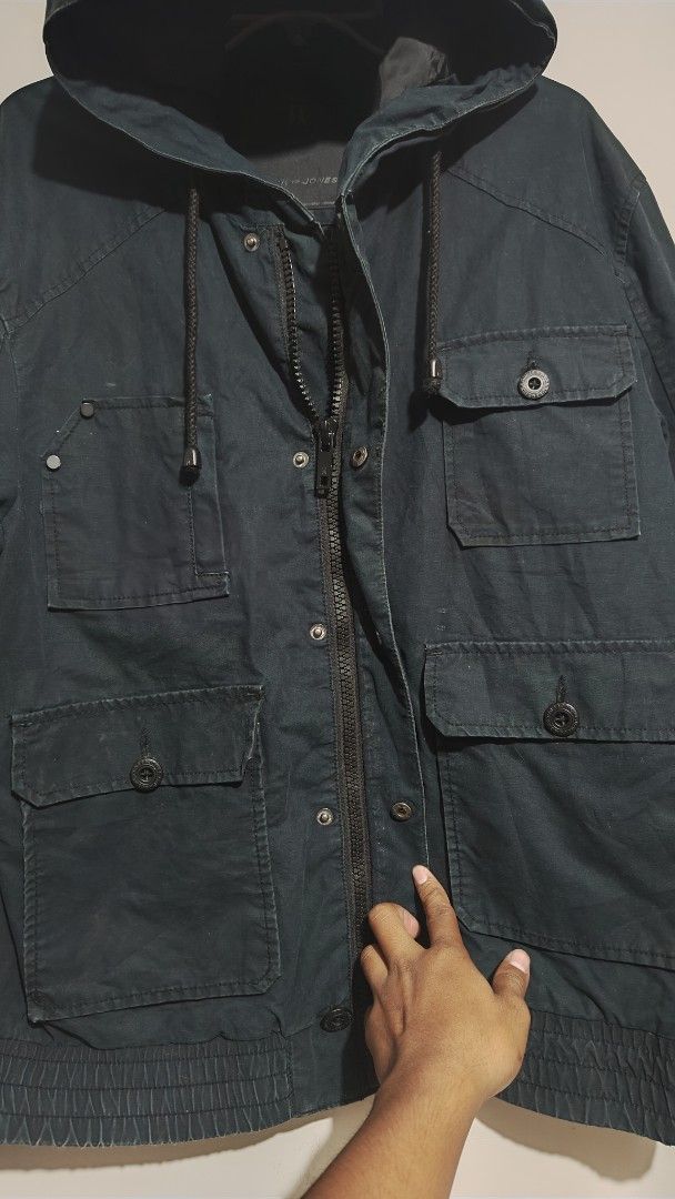 Jack & Jones Dark Blue Hooded Utility Jacket (Category: Coats, Jackets and Outerwear) located in Bulacan. Submitted by adrian2325 (Listing ID 1448099061, Image 2). Description: - Dark blue Jack & Jones jacket - Features a hood - Multiple front pockets - Zip and button closure - Ribbed hem and cuffs - Perfect for casual wear - Estimated size L or XL (check measurements if needed).