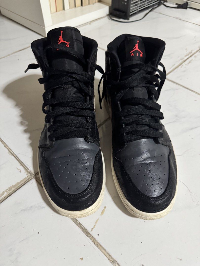 Jordan 1 Retro Bronze Medal (Category: Sneakers) located in Batangas. Submitted by matt_torobear21 (Listing ID 1448222975, Image 3). Description: Air Jordan 1 Mid SE sneakers. Black and grey colorway with rose gold accents. Mid-top silhouette. Laces are black. Soles are white and slightly aged. Great for casual wear. Size US 11.5 / Original.