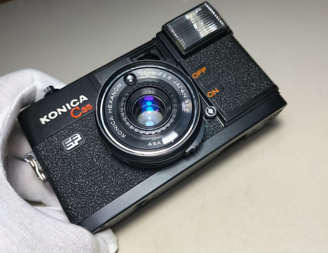Konica C35 EF w/out Timer Film Camera (Category: Cameras) located in Paranaque City. Submitted by zenfalcon.e8286d (Listing ID 1448256702, Image 3). Description: Ready to use... -Good working condition -Clad recently -Flash working -Working light meter -Clean lens and VF -Uses Zone focus -Comes with battery for light meter and for the flash with lenscap and strap -Presentable....