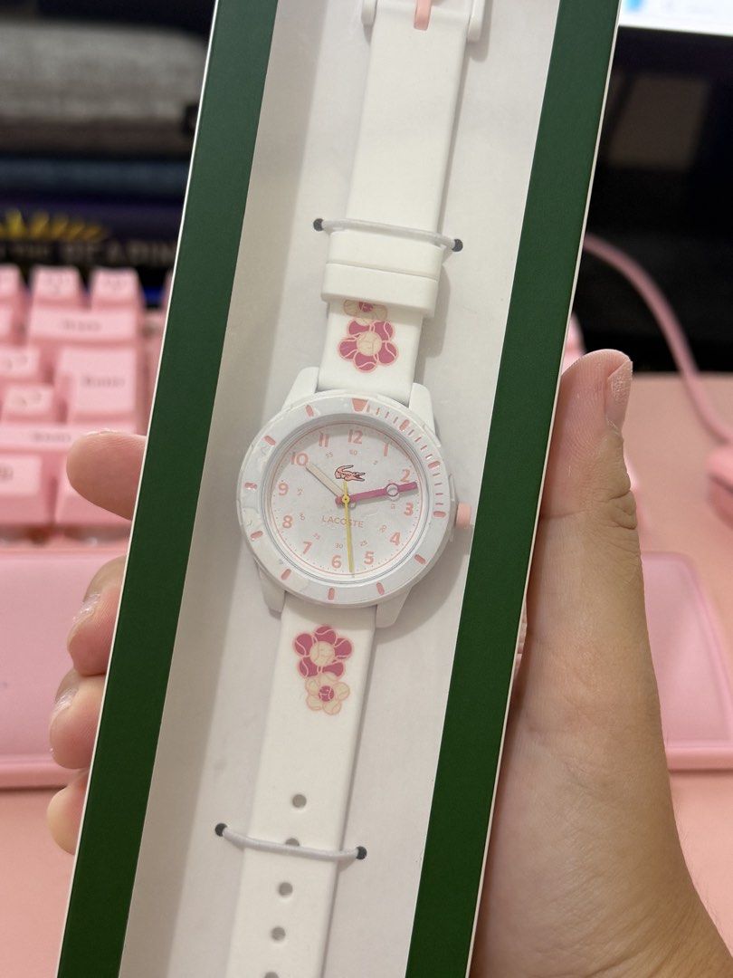Lacoste Kids Watch White Floral Strap (Category: Women's Watches) located in Alaminos. Submitted by fifthms (Listing ID 1448117724, Image 1). Description: - Authentic white Lacoste watch for kids - Adorable floral design on the strap - Pink accents on the watch face - Includes original packaging - Recommended for ages 8 and up.