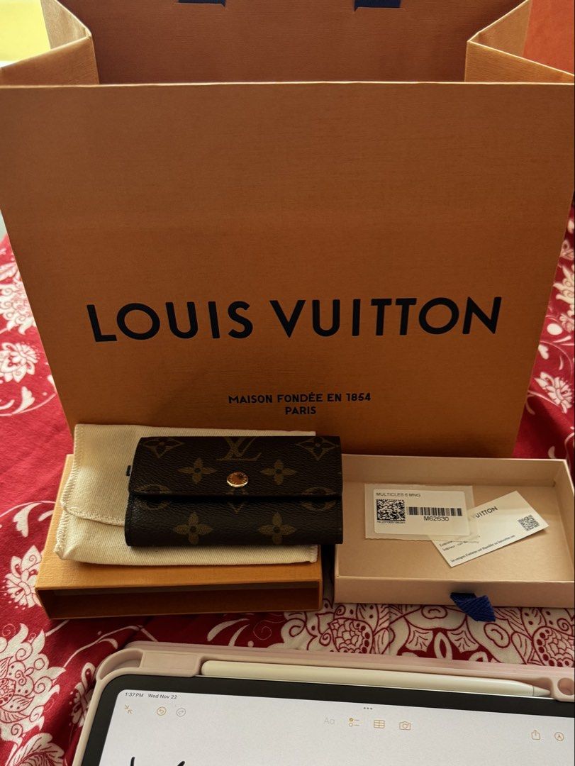 Louis Vuitton Monogram 6 Key Holder (Category: Luxury Bags & Wallets) located in Quezon City. Submitted by kyratherese (Listing ID 1448198895, Image 1). Description: - Authentic Louis Vuitton 6 Key Holder - Classic Monogram Canvas - Complete Packaging - Elegant Gold Hardware RFS: using another keyholder LAYAWAY OK.