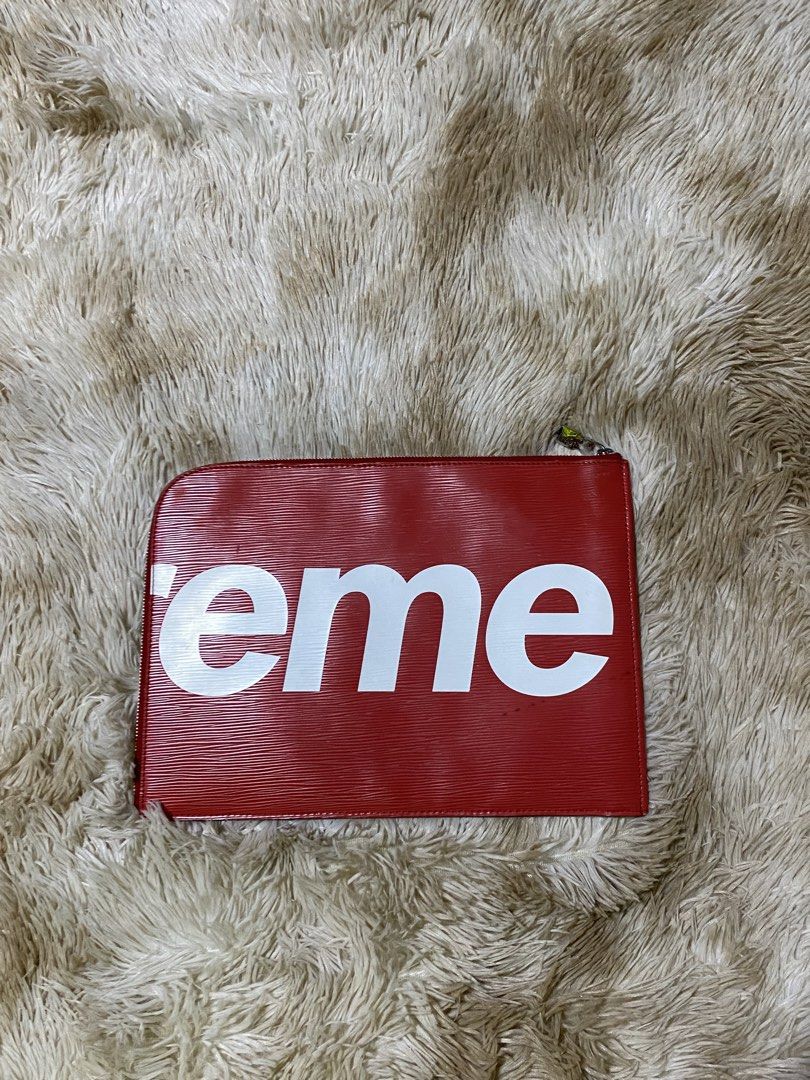 Louis Vuitton x Supreme Epi (Category: Luxury Bags & Wallets) located in Santa Ana. Submitted by tunes_vtg (Listing ID 1448222968, Image 3). Description: - Louis Vuitton x Supreme collaboration pouch - Color: Red Epi leather with white Supreme logo - Features LV monogram subtly placed - Secure zipper closure - Interior with multiple compartments for organization - Can be used as an organizer or a clutch - issue see on last pic minor only ₱2500+Sf