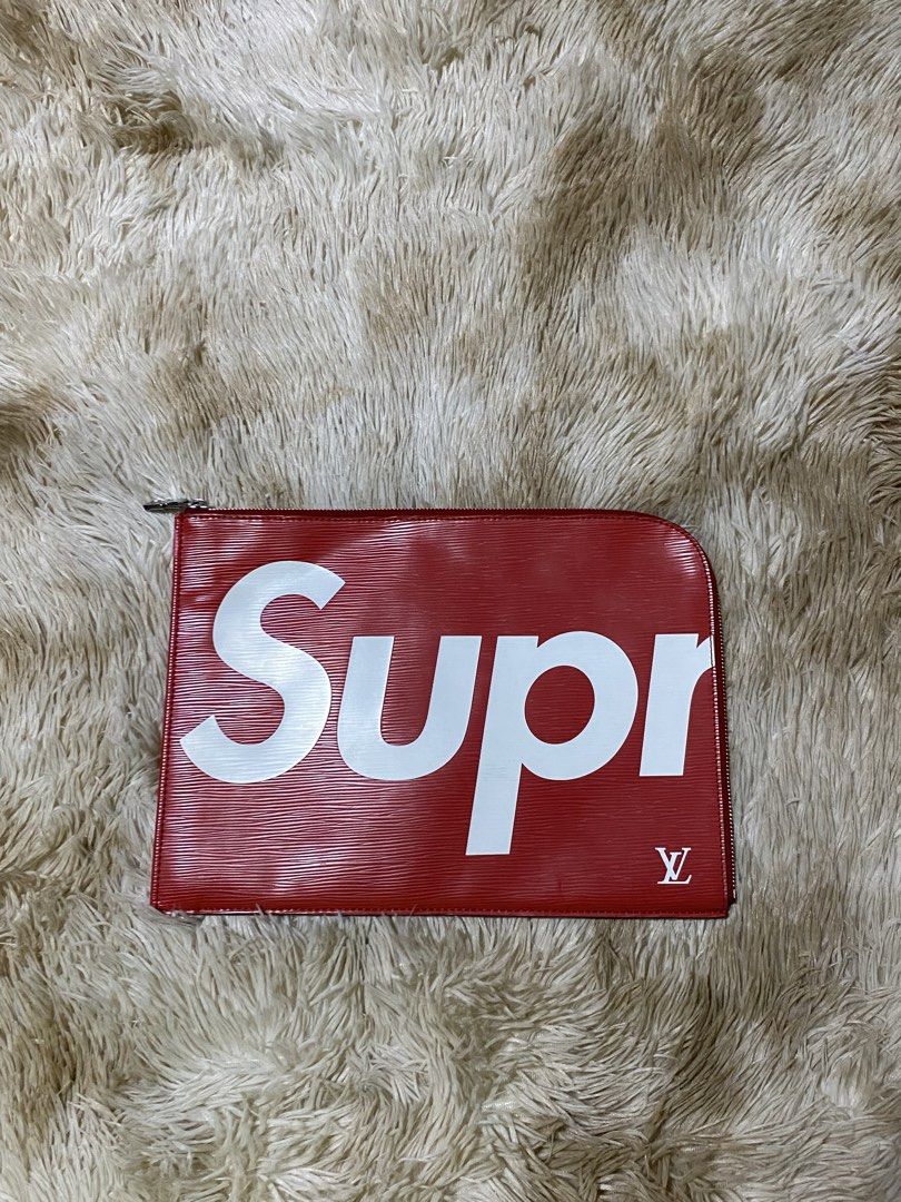 Louis Vuitton x Supreme Epi (Category: Luxury Bags & Wallets) located in Santa Ana. Submitted by tunes_vtg (Listing ID 1448222968, Image 1). Description: - Louis Vuitton x Supreme collaboration pouch - Color: Red Epi leather with white Supreme logo - Features LV monogram subtly placed - Secure zipper closure - Interior with multiple compartments for organization - Can be used as an organizer or a clutch - issue see on last pic minor only ₱2500+Sf