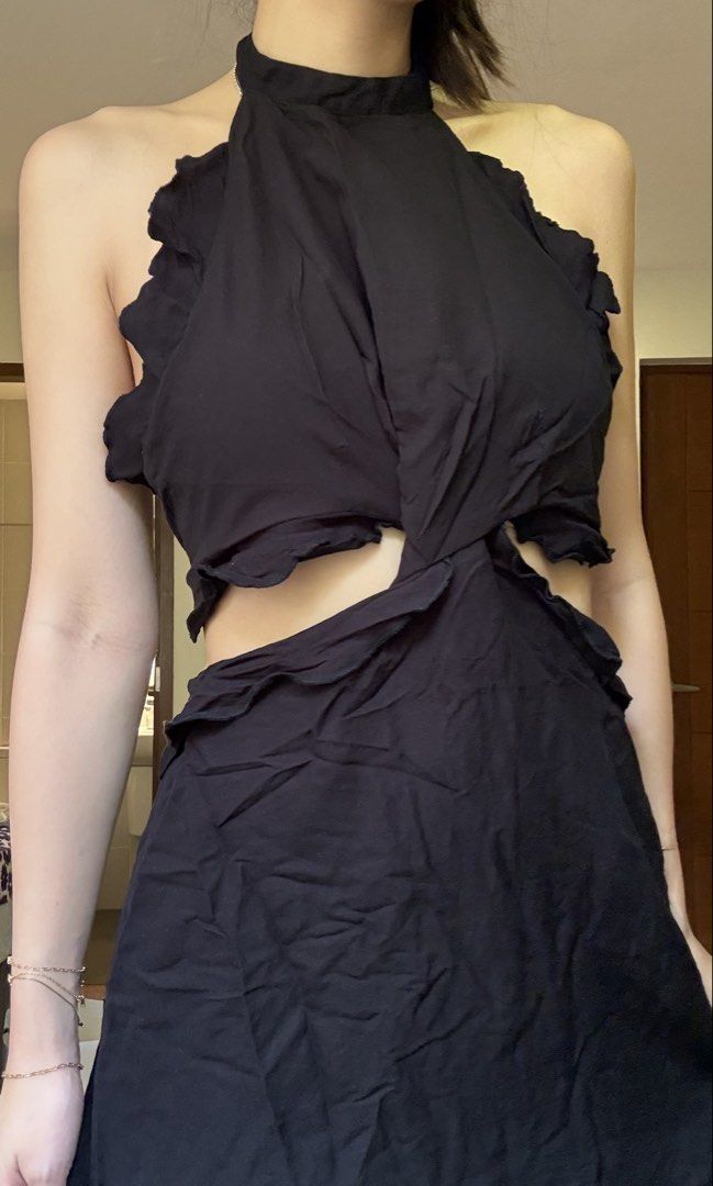 MANGO Black Halter Neck Cut-Out Dress (Category: Dresses) located in Quezon City. Submitted by kimtlee (Listing ID 1448096882, Image 2). Description: - Black MNG dress - Size: Medium (M) - Halter neck design - Trendy cut-out details - Secure tie-back closure - Elegant ruffled trim - Unique slightly crinkled fabric texture - Ideal for night outs or special occasions.